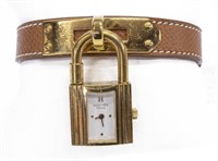 HERMES 'KELLY' LOCK WATCH ON BROWN LEATHER STRAP