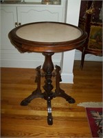 Stone-topped round table