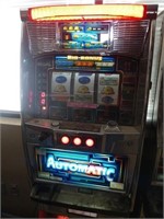 Automatic token slot machine