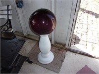 Gazing ball on cement stand