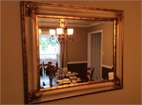 Beveled mirror and large rug