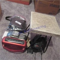 Polarod camera, small stool, alarm clock