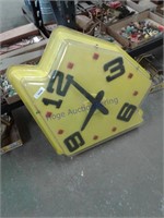 yellow plastic clock 46" T x 29" L