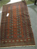 RUST COLORED RUG  37" X 62"