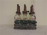 6- 1 quart Sinclair oil bottles w/ holder