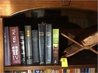 BIBLES AND BIBLE STAND ON TOP SHELF