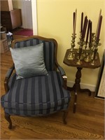Chair, side table, and candlesticks