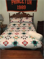 Full size wood carved bed with quilt
