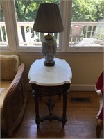 Marble top carved mahogany table & lamp