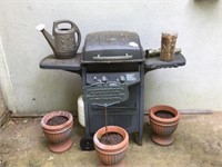 Grill, pots, and watering can