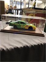 John Deer model racecar in showcase