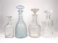 4 decanters.  Bottom of two stoppers chipped