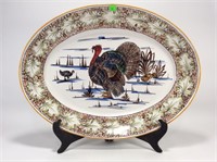 Oval turkey platter on stand. Italy 23“ x 18“