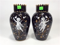 Pr. of  black glass vases, cherub & vine design,