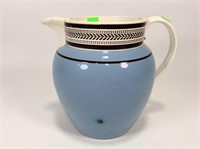 Pale blue and white mochaware pitcher, cracks in