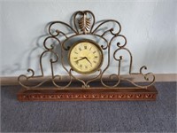 metal and wood mantel clock