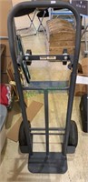 Gray metal furniture dolly with four wheels, both