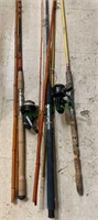 4 fishing rods and two fishing reels, both with
