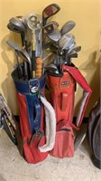Two red golf bags with a mix of golf clubs,