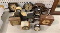 11 Antique table clocks, mostly in Wood cases,
