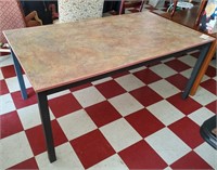 Large gray metal frame work or dining table