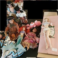 7 dolls + care bear Porcelain, indians, mermaid +