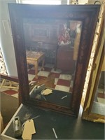 very old heavy inlaid wooden mirror