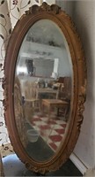 large antique gesso composite oval mirror