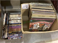 Box of record albums and a box of DVDs (395)