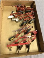 4 toy tractor plows