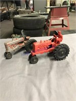 2 plastic toy tractors