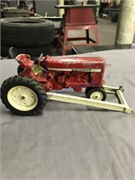 International toy tractor with attachment