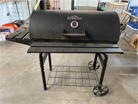 RiverGrille charcoal grill, has been used