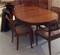 Dining table and caned wood chairs