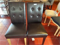 2 black dining chairs