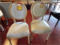 2 white dining room chairs