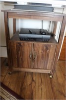 RCA VHS Player, Rolling TV Stand, & Contents
