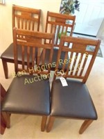 4 matching straight back cushioned dining chairs