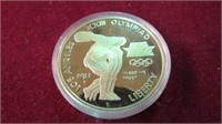 1983 US $1 XXIII OLYMPIA SILVER ROUND