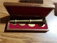 Brass item with wooden case
