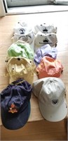 Large lot of golf hats and golf towels