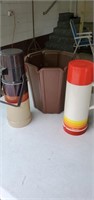 Pair of thermos and a waste basket