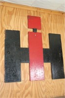Wooden International Harvester Sign used as a