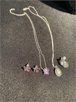 Two sets of earrings and pendants. Both marked