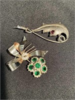 Two vintage sterling silver pins. With stones