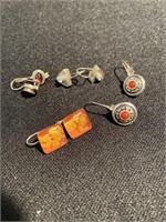 Four sets of earrings set in sterling