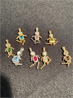 Boy and girl pendants with different colored