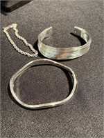 Three sterling silver bracelets two of them are