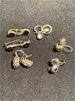 Six sets of earrings with colored stones mounted