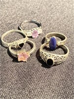 Five sterling silver rings with various colored